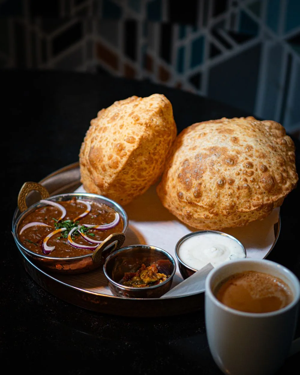 Bhimas poori and curry meal